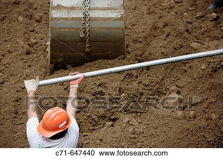 Construction worker bending pipe View Large Photo Image Stock Image - Construction worker bending pipe. Fotosearch