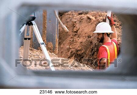 Construction worker in trench View Large Photo Image Stock Photograph - Construction worker in trench. Fotosearch