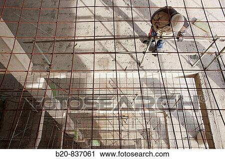 Construction worker, personal protective equipment, housing construction, concrete skeleton View Large Photo Image Stock Image - Construction worker, personal protective equipment, housing construction, concrete skeleton. Fotosearch