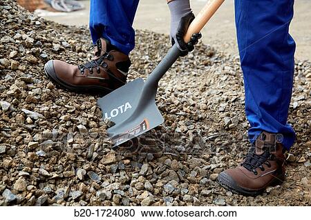 Construction worker shoveling, hand tools for construction, Housing Construction, Basque Country, Spain View Large Photo Image Stock Image - Construction worker shoveling, hand tools for construction, Housing Construction, Basque Country, Spain. Fotosearch