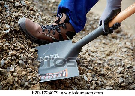Construction worker shoveling, hand tools for construction, Housing Construction, Basque Country, Spain View Large Photo Image Stock Photo - Construction worker shoveling, hand tools for construction, Housing Construction, Basque Country, Spain. Fotosearch