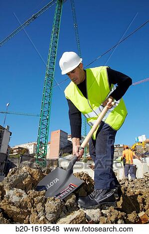 Construction worker with a shovel, Building hand tool, Donostia, San Sebastian, Gipuzkoa, Basque Country, Spain View Large Photo Image Stock Photo - Construction worker with a shovel, Building hand tool, Donostia, San Sebastian, Gipuzkoa, Basque Country, Spain. Fotosearch