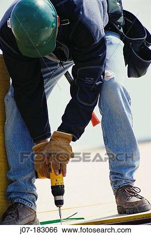 Construction worker with drill. Texas. USA View Large Photo Image Stock Photograph - Construction worker with drill. Texas. USA. Fotosearch