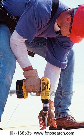 Construction worker with drill. Texas. USA View Large Photo Image Stock Photography - Construction worker with drill. Texas. USA. Fotosearch