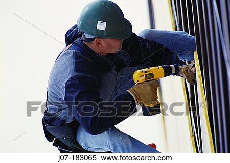 Construction worker with drill. Texas. USA View Large Photo Image Stock Photography - Construction worker with drill. Texas. USA. Fotosearch