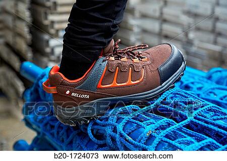 Stock Image - Construction worker with safety boots equipped, House Construction, Basque Country, Spain. Fotosearch