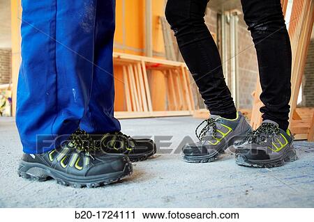 Construction worker with safety boots equipped, House Construction, Basque Country, Spain View Large Photo Image Stock Image - Construction worker with safety boots equipped, House Construction, Basque Country, Spain. Fotosearch