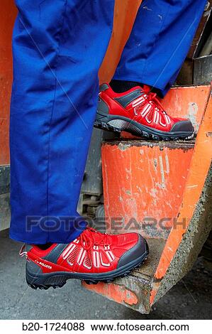 Construction worker with safety boots equipped, House Construction, Basque Country, Spain View Large Photo Image Stock Photo - Construction worker with safety boots equipped, House Construction, Basque Country, Spain. Fotosearch