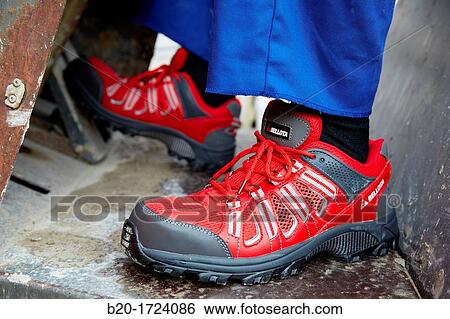 Construction worker with safety boots equipped, House Construction, Basque Country, Spain View Large Photo Image Stock Photograph - Construction worker with safety boots equipped, House Construction, Basque Country, Spain. Fotosearch