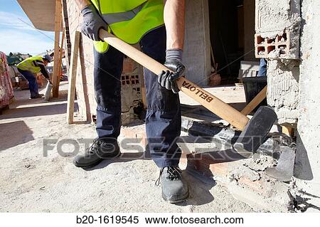 Construction worker with sledgehammer, Building hand tool, Donostia, San Sebastian, Gipuzkoa, Basque Country, Spain View Large Photo Image Stock Photography - Construction worker with sledgehammer, Building hand tool, Donostia, San Sebastian, Gipuzkoa, Basque Country, Spain. Fotosearch