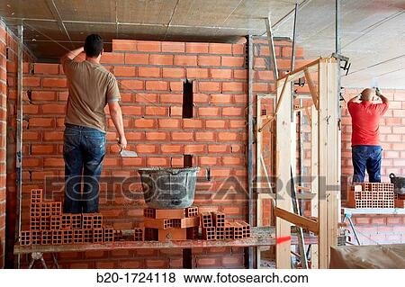 Construction worker with trowel, hand tools, Placement of brick with mortar on interior walls of housing, House Construction, Basque Country, Spain View Large Photo Image Stock Photo - Construction worker with trowel, hand tools, Placement of brick with mortar on interior walls of housing, House Construction, Basque Country, Spain. Fotosearch