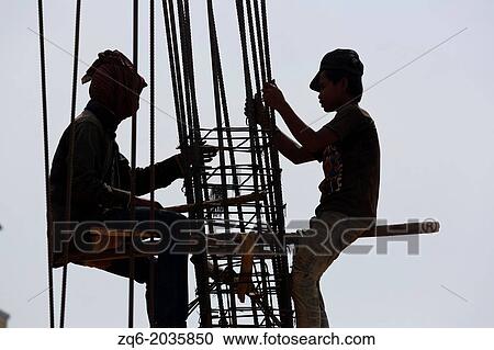 Stock Image - Construction Workers in Sihanoukville, Cambodia.. Fotosearch