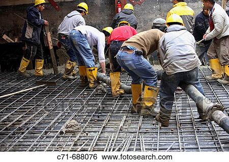 Construction workers with concrete pumper hose pouring concrete floor View Large Photo Image Stock Photograph - Construction workers with concrete pumper hose pouring concrete floor. Fotosearch