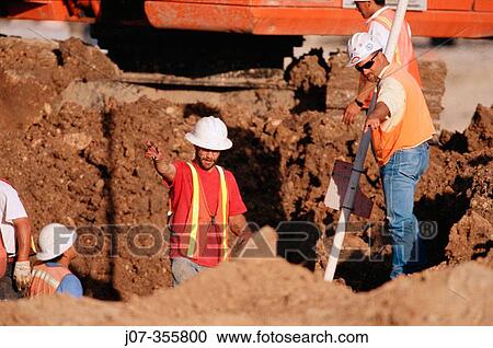 Constructor supervisor and workers in trench. Texas. USA. View Large Photo Image Stock Image - Constructor supervisor and workers in trench. Texas. USA.. Fotosearch