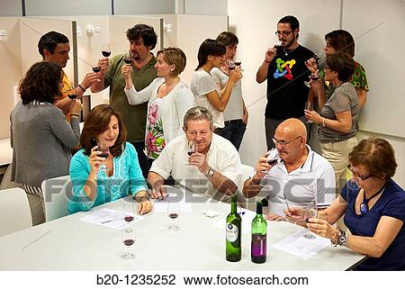 Stock Image - Consumers tasting wine tutored by a sensory analysis specialist, AZTI-Tecnalia Marine and Food Research Center, Derio, Bizkaia, Euskadi, Spain. Fotosearch