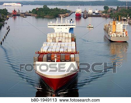 Container ship, the Kiel Canal, Holtenau, Kiel, Kiel Fith, the Baltic Sea, Schleswig-Holstein, Germany, Europe. View Large Photo Image Stock Image - Container ship, the Kiel Canal, Holtenau, Kiel, Kiel Fith, the Baltic Sea, Schleswig-Holstein, Germany, Europe.. Fotosearch