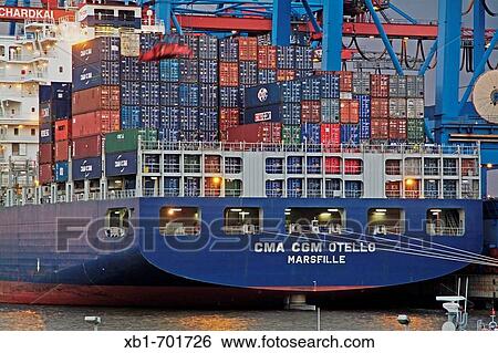 Container vessel is being loaded, unloaded at Burchard quay, evening mood, Hamburg port, Hamburg, Germany, Europe View Large Photo Image Stock Photograph - Container vessel is being loaded, unloaded at Burchard quay, evening mood, Hamburg port, Hamburg, Germany, Europe. Fotosearch