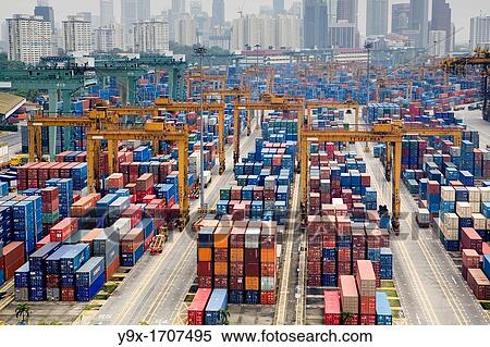 Containers stacked together at the Port of Singapore Authority PSA in Singapore PSA Singapore Terminals is the world largest container transhipment hub, handling about one-fifth of the world's total container transhipment throughput View Large Photo Image Stock Photography - Containers stacked together at the Port of Singapore Authority PSA in Singapore PSA Singapore Terminals is the world largest container transhipment hub, handling about one-fifth of the world's total container transhipment throughput. Fotosearch