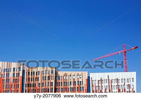 Stock Photograph - Contemporary Sumatrakontor facade under a clear blue sky at the HafenCity development in Hamburg, Germany.. Fotosearch