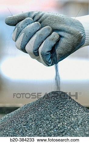 Stock Image - Control of abrasive powder for the fabrication of abrasive disks. Metal Industry.. Fotosearch