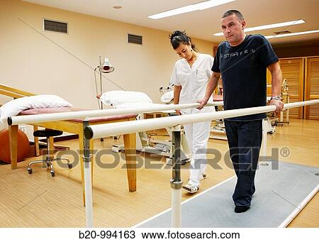 Control of walking, parallel bars, reeducation exercise, rebahilitation. Policlinica Gipuzkoa, San Sebastian, Donostia, Euskadi, Spain View Large Photo Image Stock Image - Control of walking, parallel bars, reeducation exercise, rebahilitation. Policlinica Gipuzkoa, San Sebastian, Donostia, Euskadi, Spain. Fotosearch