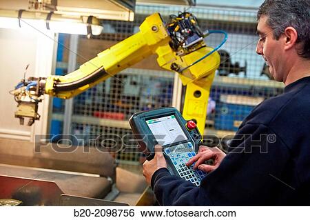 Stock Photograph - Control panel. Robot with vision. Loading transfer machine machining. Machined Indecober. Machining of precision parts in series. Automotive industry. Berriz. Bizkaia. Basque Country. Spain.. Fotosearch