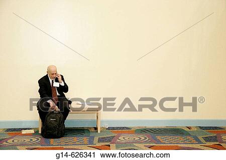 Convention Center, Graphic of the Americas, senior male businessman, cell phone, bench. Miami Beach. Florida. USA. View Large Photo Image Stock Image - Convention Center, Graphic of the Americas, senior male businessman, cell phone, bench. Miami Beach. Florida. USA.. Fotosearch