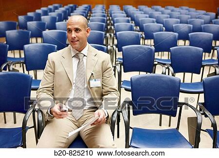 Stock Image - Conventioneer in lecture hall, convention center, Kursaal Center. San Sebastian, Guipuzcoa, Basque Country, Spain. Fotosearch