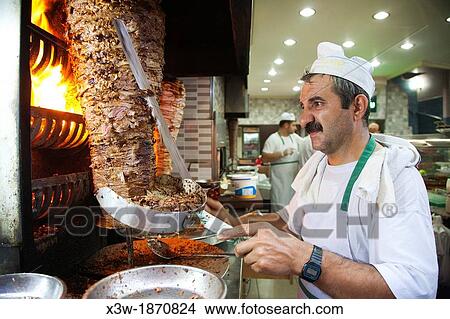Picture - cook cuts the kebab, restaurant, trabzon, black sea, turkey, asia. Fotosearch