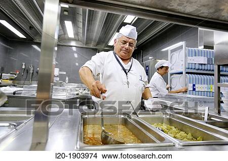 Picture - Cook, Food menu preparation, hospital kitchen, Onkologikoa Hospital, Oncology Institute, Case Center for prevention, diagnosis and treatment of cancer, Donostia, San Sebastian, Gipuzkoa, Basque Country, Spain. Fotosearch