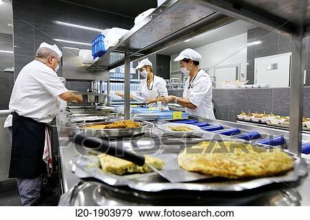 Stock Photo - Cook, Food menu preparation, hospital kitchen, Onkologikoa Hospital, Oncology Institute, Case Center for prevention, diagnosis and treatment of cancer, Donostia, San Sebastian, Gipuzkoa, Basque Country, Spain. Fotosearch