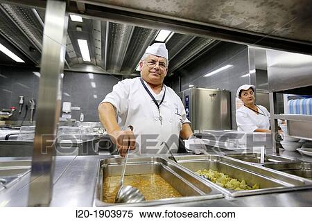 Stock Photography - Cook, Food menu preparation, hospital kitchen, Onkologikoa Hospital, Oncology Institute, Case Center for prevention, diagnosis and treatment of cancer, Donostia, San Sebastian, Gipuzkoa, Basque Country, Spain. Fotosearch