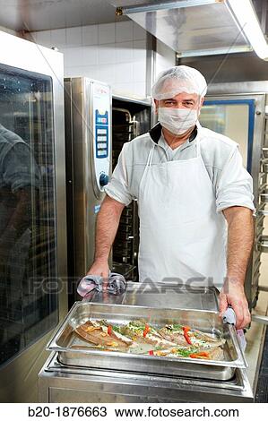 Cook preparing food, Hospital meal preparation, Kitchen, Hospital Donostia, San Sebastian, Gipuzkoa, Basque Country, Spain View Large Photo Image Stock Image - Cook preparing food, Hospital meal preparation, Kitchen, Hospital Donostia, San Sebastian, Gipuzkoa, Basque Country, Spain. Fotosearch