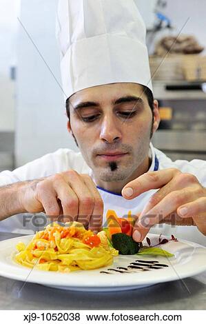 Cook who prepares noodles View Large Photo Image Stock Photo - Cook who prepares noodles. Fotosearch