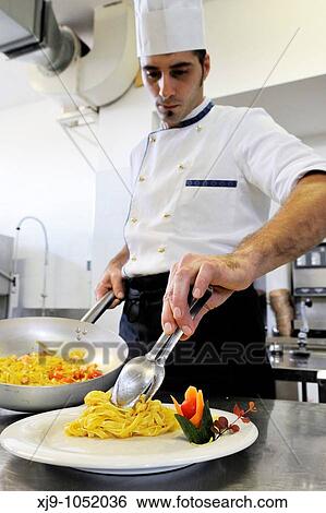 Cook who prepares noodles View Large Photo Image Stock Photograph - Cook who prepares noodles. Fotosearch