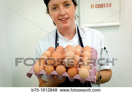 cook with egg tray View Large Photo Image Stock Photo - cook with egg tray. Fotosearch