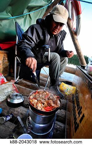 Cooking onboard a timber raft on Klar Alven. Varmland, Sweden. View Large Photo Image Stock Photo - Cooking onboard a timber raft on Klar Alven. Varmland, Sweden.. Fotosearch