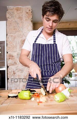 Cooking young man. View Large Photo Image Stock Image - Cooking young man.. Fotosearch
