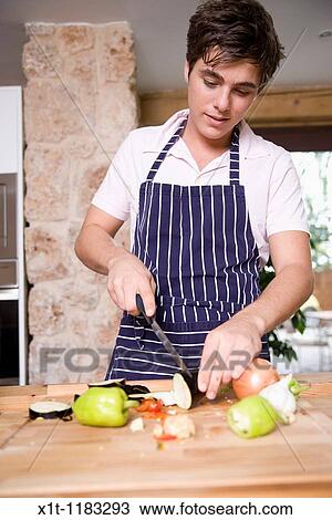 Cooking young man. View Large Photo Image Stock Image - Cooking young man.. Fotosearch