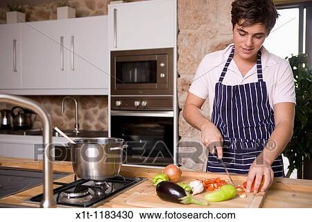Stock Image - cooking young man.. Fotosearch