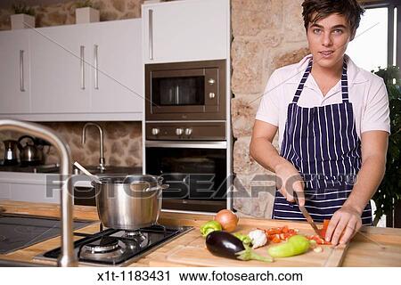 Stock Image - cooking young man.. Fotosearch