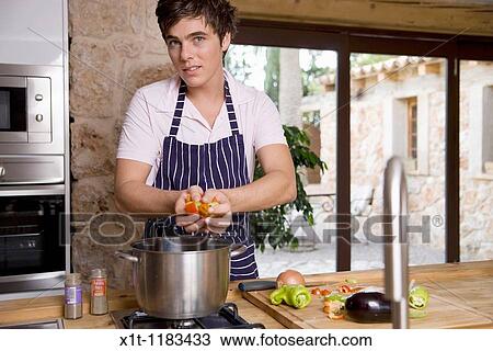 cooking young man. View Large Photo Image Stock Image - cooking young man.. Fotosearch