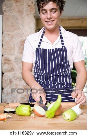 Stock Photo - Cooking young man.. Fotosearch