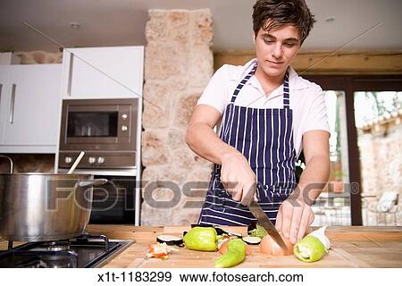 Cooking young man. View Large Photo Image Stock Photo - Cooking young man.. Fotosearch