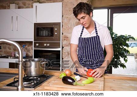 cooking young man. View Large Photo Image Stock Photo - cooking young man.. Fotosearch