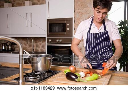cooking young man. View Large Photo Image Stock Photo - cooking young man.. Fotosearch
