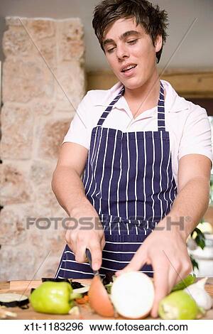 Cooking young man. View Large Photo Image Stock Photograph - Cooking young man.. Fotosearch