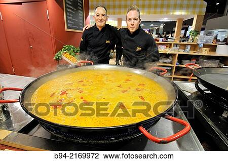 Cooks with a spanish paella. Alimentaria, Sal? n Internacional de la Alimentaci? n y Bebidas, Fira de Barcelona. L? Hospitalet de Llobregat, Barcelona,??Catalua, Espaa. View Large Photo Image Stock Image - Cooks with a spanish paella. Alimentaria, Sal? n Internacional de la Alimentaci? n y Bebidas, Fira de Barcelona. L? Hospitalet de Llobregat, Barcelona,??Catalua, Espaa.. Fotosearch