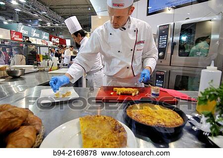 Cooks working in Alimentaria, International Food and Drinks Exhibition, Fira de Barcelona. L? Hospitalet de Llobregat, Barcelona, Catalonia, Spain. View Large Photo Image Stock Photo - Cooks working in Alimentaria, International Food and Drinks Exhibition, Fira de Barcelona. L? Hospitalet de Llobregat, Barcelona, Catalonia, Spain.. Fotosearch