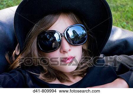 cool girl black hat View Large Photo Image Picture - cool girl black hat. Fotosearch